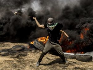 Gaza rioter hurling stones