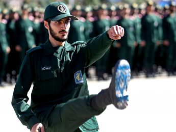 An Iranian Revolutionary Guard cadet with Israeli flag on sole of shoe
