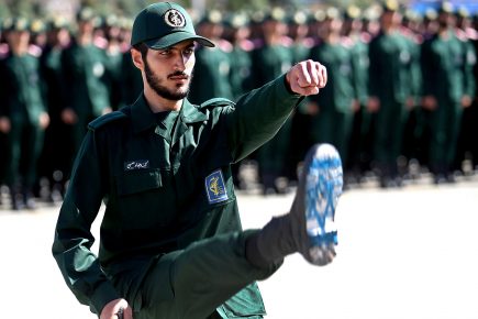 An Iranian Revolutionary Guard cadet with Israeli flag on sole of shoe