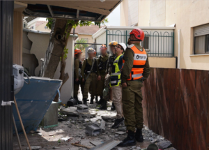 A missile impact site at a home in northern Israel as Iran and its allies launch hundreds of missiles at densely populated residential areas